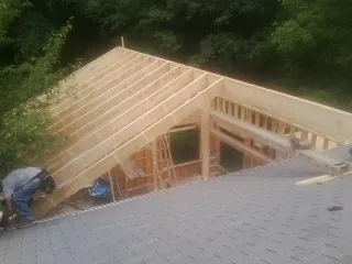 Framing a new roof addition that ties into an existing shingle roof in Harwood